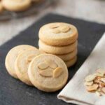 almond-shortbread-cookies-hero-shot-1-stacked-cookies-on-dark-slate