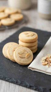 almond-shortbread-cookies-hero-shot-1-stacked-cookies-on-dark-slate