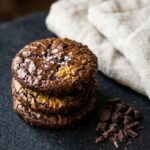 brownie-crinkle-cookies-hero-shot-1-stacked-cookies-on-dark-slate