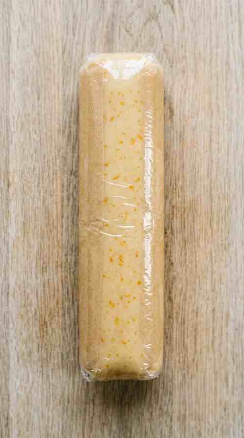orange-shortbread-cookie-process-step-5-chilling-dough-log-wrapped-in-plastic