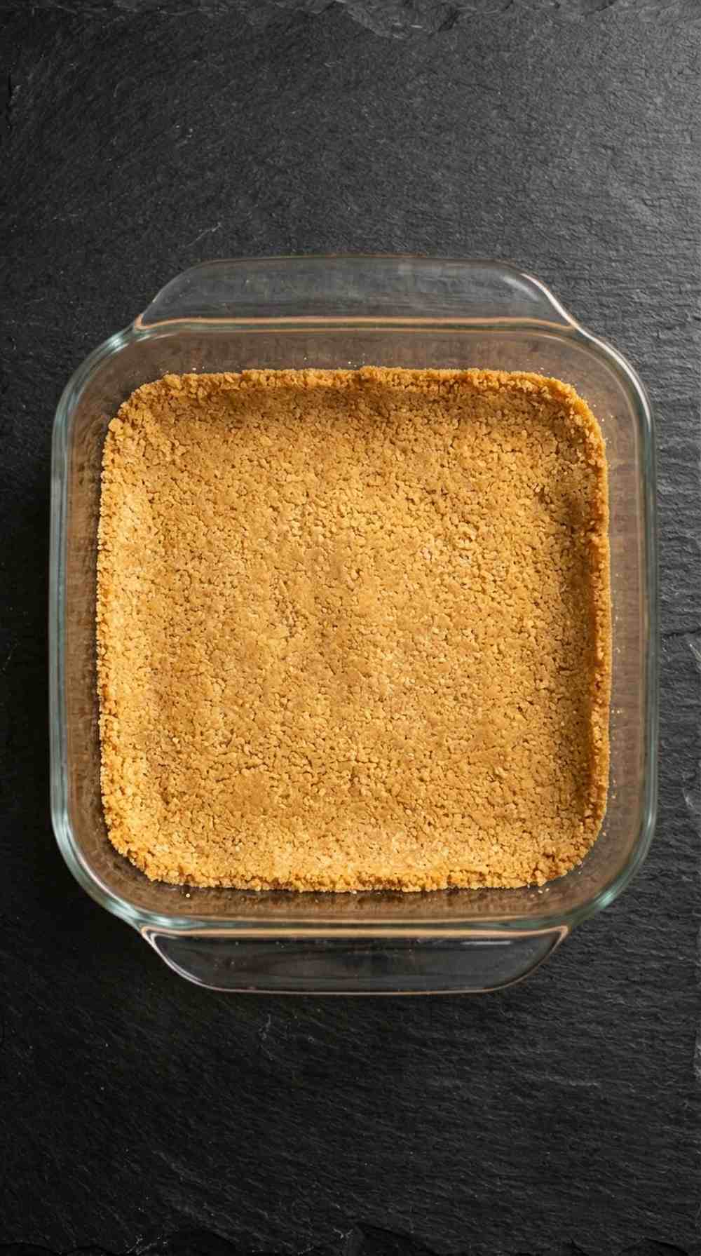 Graham cracker crust pressed into the bottom of the baking dish