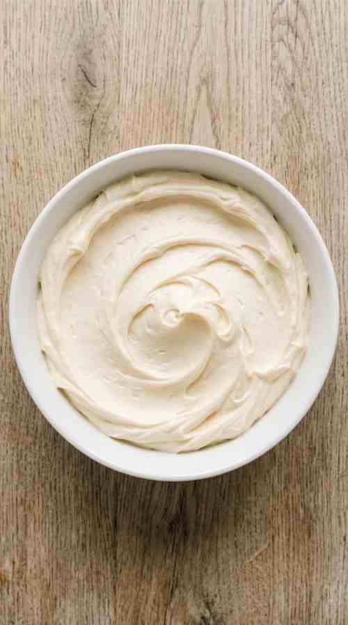 pistachio-shortbread-cookies-process-step-2-creamed-butter-and-powdered-sugar-in-white-bowl