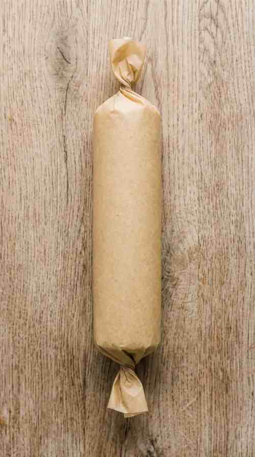 pistachio-shortbread-cookies-process-step-5-dough-log-wrapped-in-parchment-for-chilling