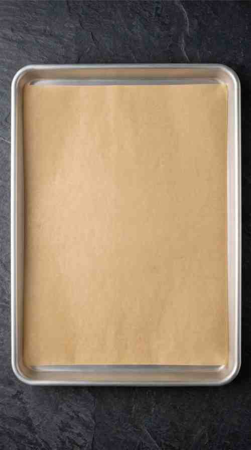 whipped-shortbread-cookies-lined-baking-sheet